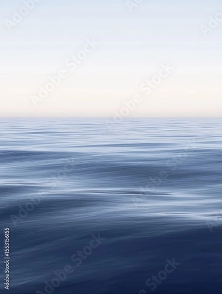 Fototapeta Tranquil and ethereal seascape with smooth, rippling water merging into a pale sky, creating a minimalist and calming horizon view perfect for meditation and relaxation