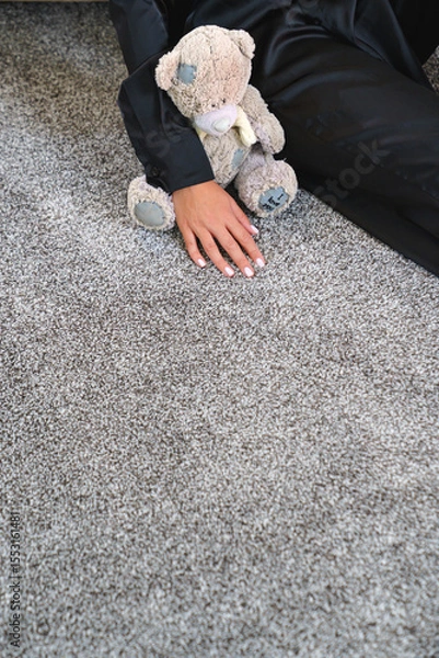 Obraz a woman's hand touching the grey Interior pile carpet