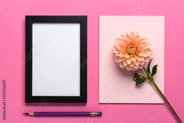 Fototapeta Frame mockup with flower and pencil on pink background flat lay art