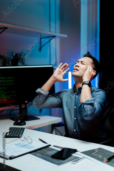 Fototapeta Stressed programmers, working overtime, developers feeling frustrated while fixing complex code errors are the challenges faced in software development.