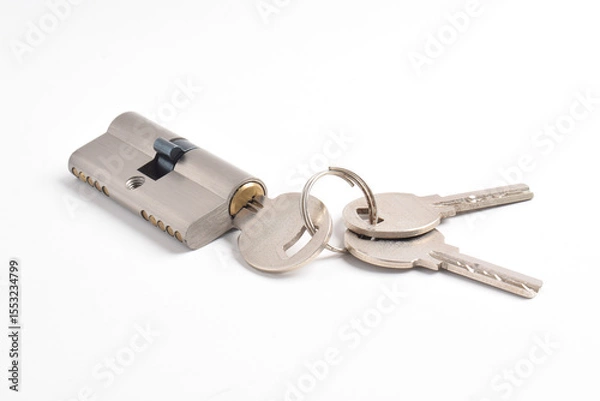 Obraz The cylinder of the lock with a pair of keys and isolated on the white background.