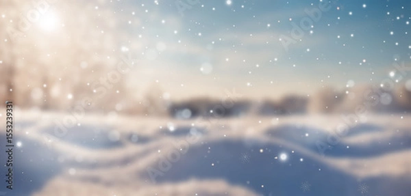 Fototapeta A scenic snowy field with pine trees in the background, bright sunlight, and falling snowflakes, creating a peaceful and magical winter wonderland.