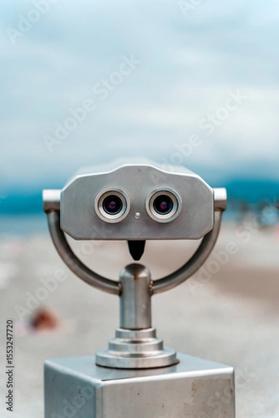 Fototapeta Seaside Binocular Viewer with Blurred Beach Background