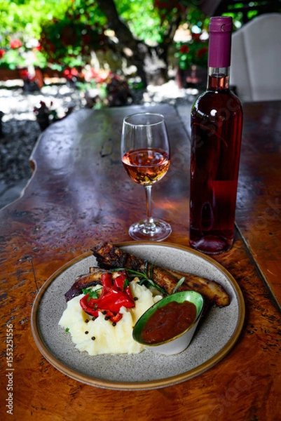 Fototapeta Pork ribs with mashed potatoes and sauce with wine