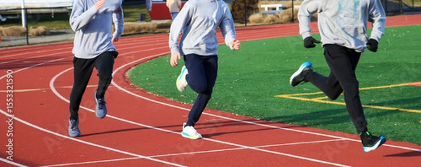 Obraz Three Runners Train on Track in Daytime Competition