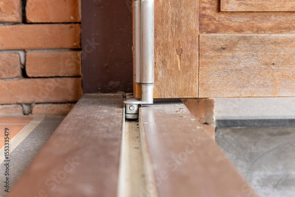 Fototapeta Dirty rail bottom  running bifold system is stuck.