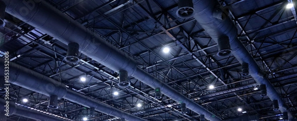 Fototapeta Black insulation air duct install on the ceiling of the structure and are used to deliver cool air from the HVAC air conditioning system of large buildings