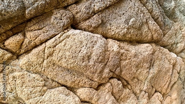 Fototapeta Craggy ancient stone texture resembling nature's patchwork quilt, embodying Earth's timeless geologic dance on Geologists Day
