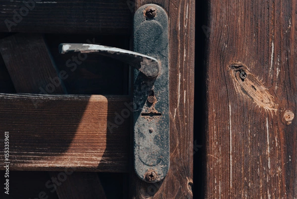Obraz old vintage door handle and lock on wooden door