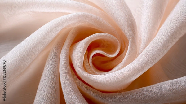 Fototapeta A beautiful white fabric in a spiral pattern, set against a pastel peach-colored background