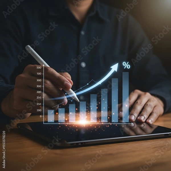 Fototapeta Person using stylus on tablet to analyze upward trending financial growth chart