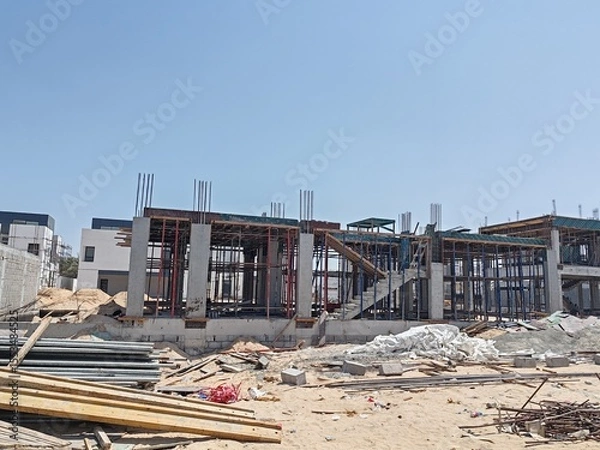 Obraz Under Construction House Or Villa's With Concreate Block Or Bricks.
Exterior View 02 Story luxurious Modern Design House architecture.
InComplete residential Villa Structure with Erected Scaffolding.