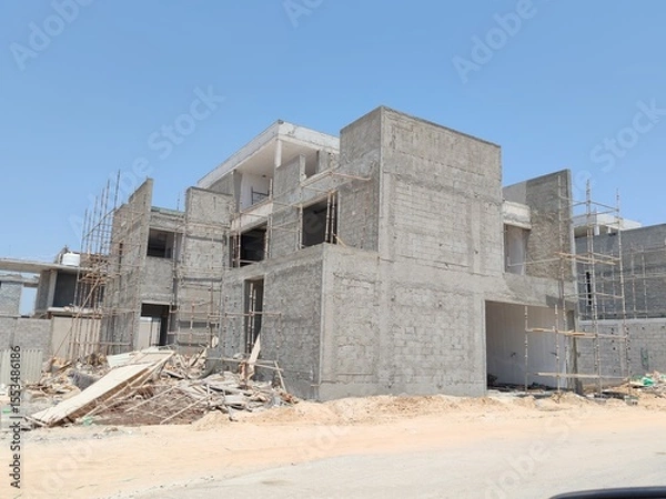 Fototapeta Under Construction House Or Villa's With Concreate Block Or Bricks.
Exterior View 02 Story luxurious Modern Design House architecture.
InComplete residential Villa Structure with Erected Scaffolding.