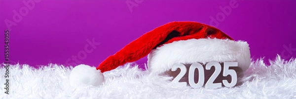 Fototapeta White fluffy 3D 2025 numbers with Santa hat set on joyful purple background to celebrate holiday spirit and new year cheer