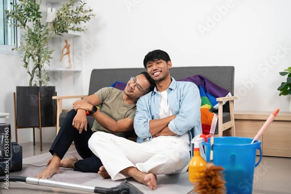 Obraz Cozy Moments and Cleaning. Two friends enjoying time together while tidying their home.