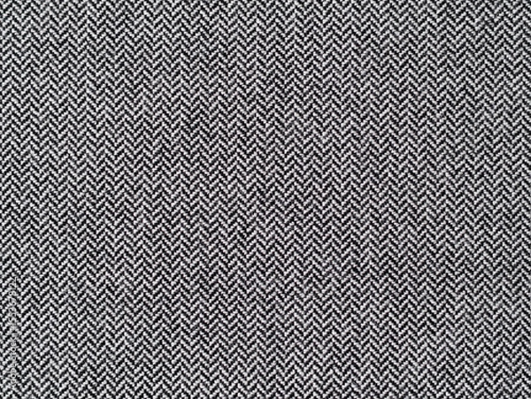 Fototapeta Herringbone or broken twill weave fabric pattern close-up. Texture of a textile material. Abstract background from the cloth surface.