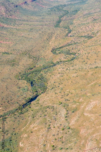 Fototapeta Directly below river meanders through valley in Kimberley