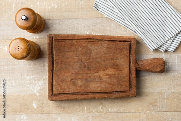 Fototapeta Blank Empty Rustic Wooden Cutting Board On Wooden Table. Food Background Copy Space Top View