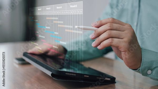 Fototapeta Digital Timeline and Project Management Interface, business professional interacting with a digital timeline on a tablet, representing project planning, schedule tracking, and AI-powered management.