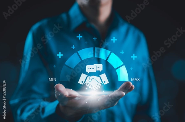 Obraz Trusted Partner and Business Collaboration Concept. Businessman holding handshake icon with trust level gauge, representing business partnership, reliability, professional transparency trustworthy,