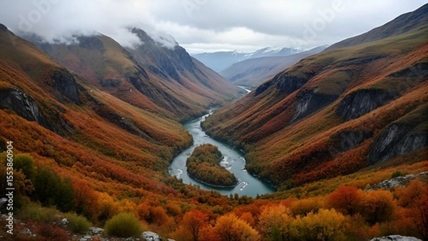 Fototapeta Aerial view of a vibrant mountain landscape, showcasing vivid foliage colors in autumn, with winding rivers cutting through.