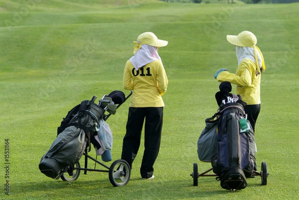 Obraz two caddies at a golf course