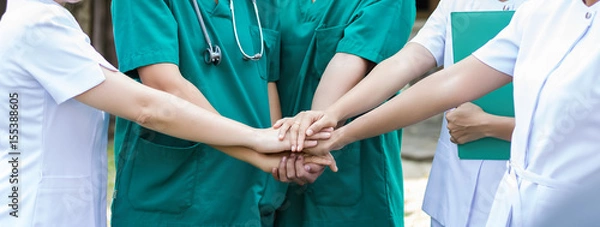 Fototapeta Doctors and nurses coordinate hands. Concept Teamwork