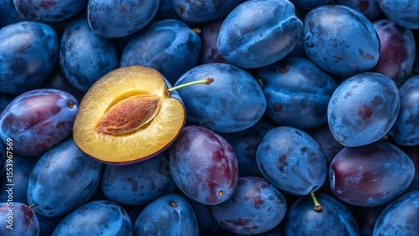 Obraz Blue plums background. Suitable for marketing or business purposes. Panoramic banner with place for text
