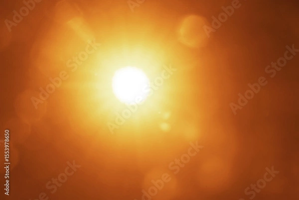 Obraz yellow golden orange sun rays of light. bokeh blurred background. Sunny backdrop, sun with lens flare on sky, Shining sun. clear sky. Solar copy space. Natural Sunrays of bright sun on summer day