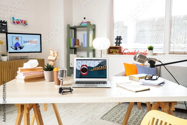 Fototapeta Podcaster's workplace with laptop and microphones in studio