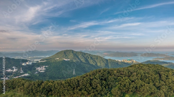 Fototapeta June 8 2025 Scenic View of Lush Green Hills and Distant Mountain Ranges