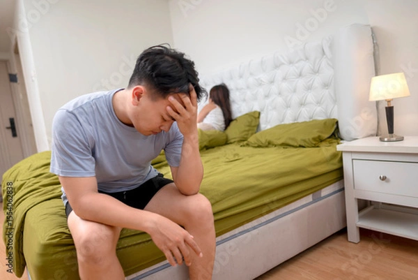 Fototapeta Indonesian southeast asian man disappointed in himself because of premature ejaculation and erectile problems. The man lost confidence with an unhappy and unsatisfied wife
