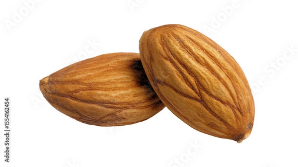 Fototapeta two almonds are shown on a white background