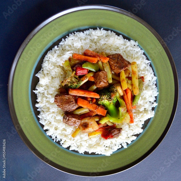 Fototapeta Beef and vegetable stir fry with jasmine rice and soy and honey sauce. 