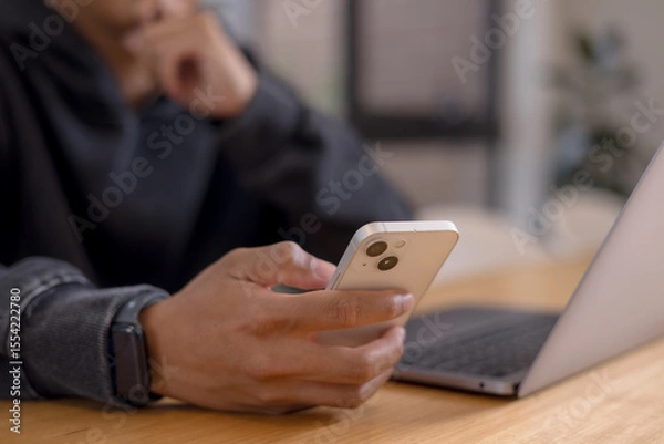 Fototapeta Social media and digital online concept, man using smart phone. The concept of living on vacation and playing social media. Social Distancing ,Working From Home