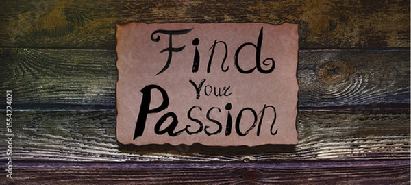 Fototapeta Find your Passion, handwriting text on craft paper with burned edges. Old wooden textured background. Motivational saying symbolizes self improvement, exploration, goals. Concept of self-Discovery.