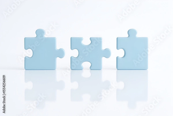 Fototapeta Three puzzle pieces on a white surface, teamwork concept