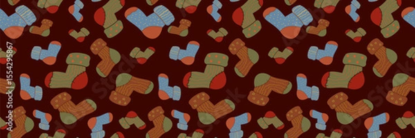 Fototapeta Cozy seamless vector pattern of warm autumn socks on a dark red background. Perfect for digital backgrounds, hygge-themed designs, and seasonal comfort.