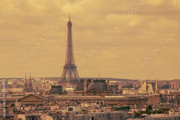 Obraz retro style photo of Eiffel tower and roofs of buildings in Paris