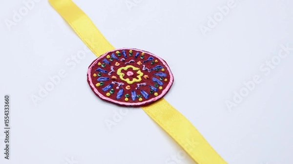 Fototapeta Beautiful and unique handmade rakhi with 3d liner design on felt sheet and ribbon