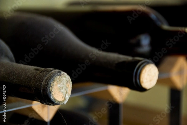 Fototapeta Wine-bottles, old and dusty and containing home-made wine