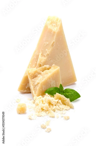 Obraz Pieces of Parmesan cheese with grated cheese and basil leaves on white background