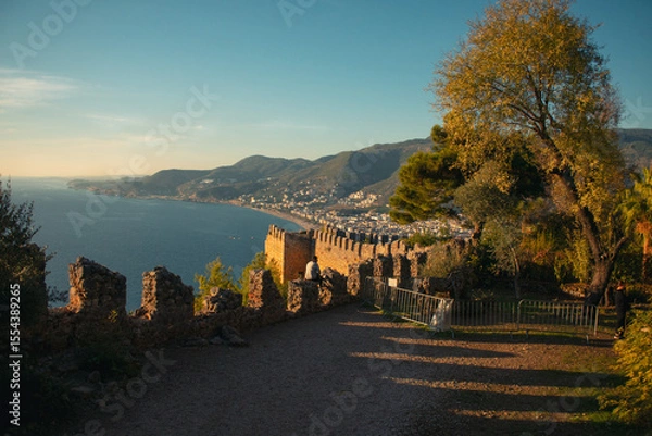 Fototapeta Ancient ruins on the seashore at golden hour in Turkey