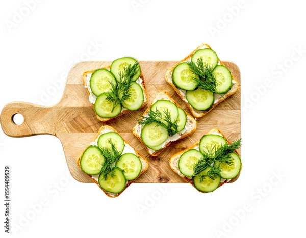 Fototapeta Cucumber Sandwiches with Dill on Wooden Board – Top View

