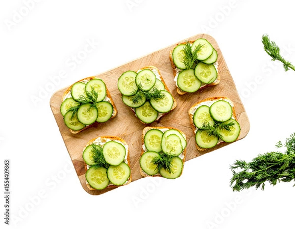Fototapeta Cucumber Sandwiches with Dill on Wooden Board – Top View

