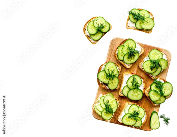Fototapeta Cucumber Sandwiches with Dill on Wooden Board – Top View

