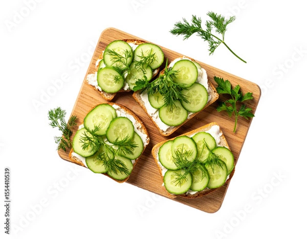 Fototapeta Cucumber Sandwiches with Dill on Wooden Board – Top View


