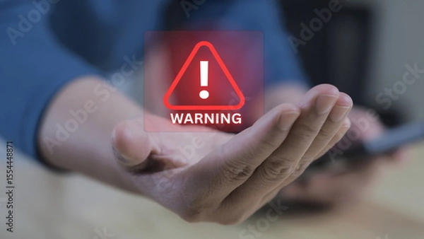 Fototapeta Popup alert on a digital screen, warning of malware or phishing attacks. Represents real-time cybersecurity risk and online safety awareness.