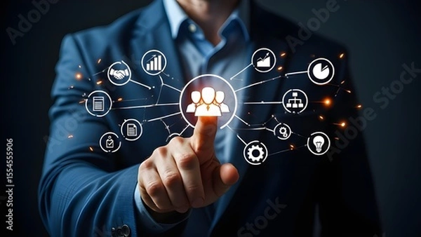 Fototapeta Businessman interacting with a digital network of business icons and data visualization