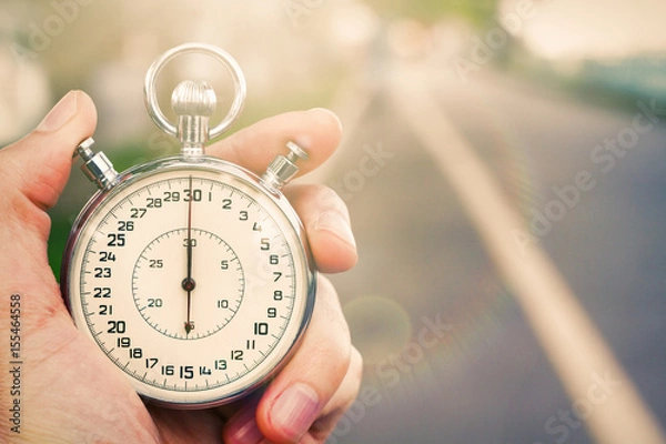 Obraz Old vintage chronometer in young man hand ready to start